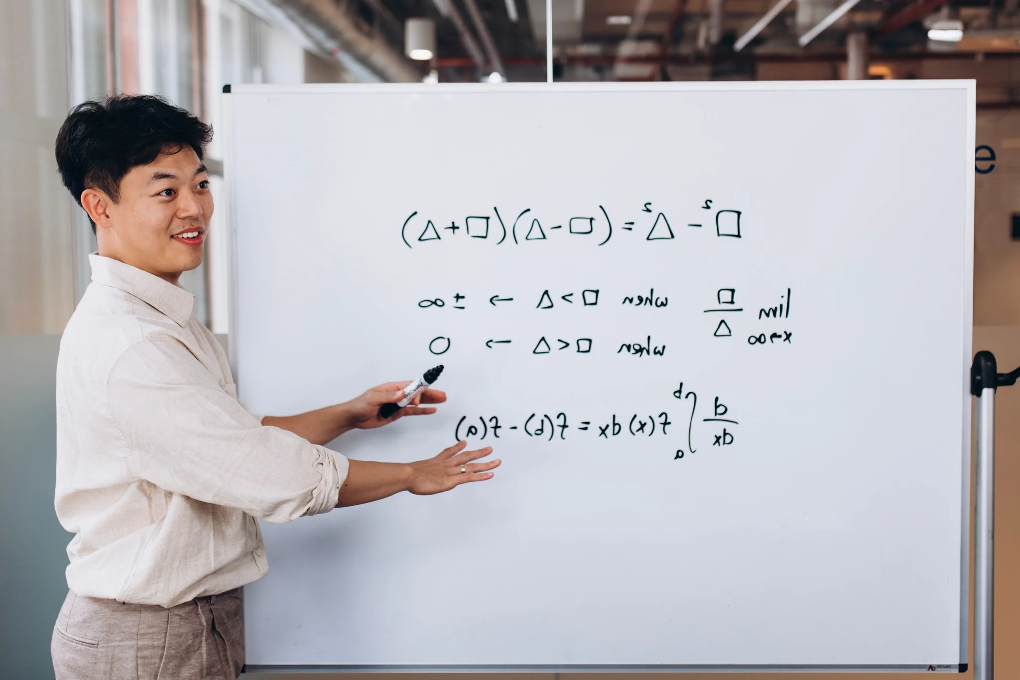 Eddie Kang teaching at whiteboard